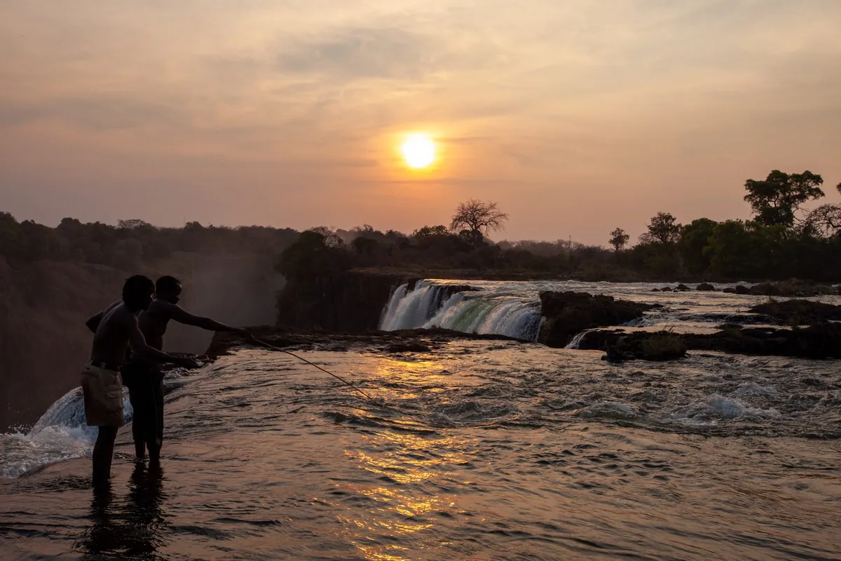 Sunset on the lip of the falls